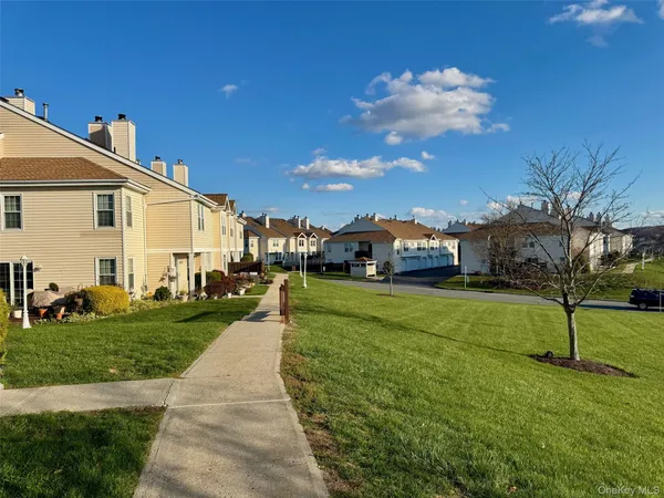 a view of a house with a back yard