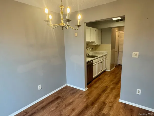 a view of a kitchen from the hallway