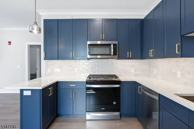 a kitchen with a sink and refrigerator