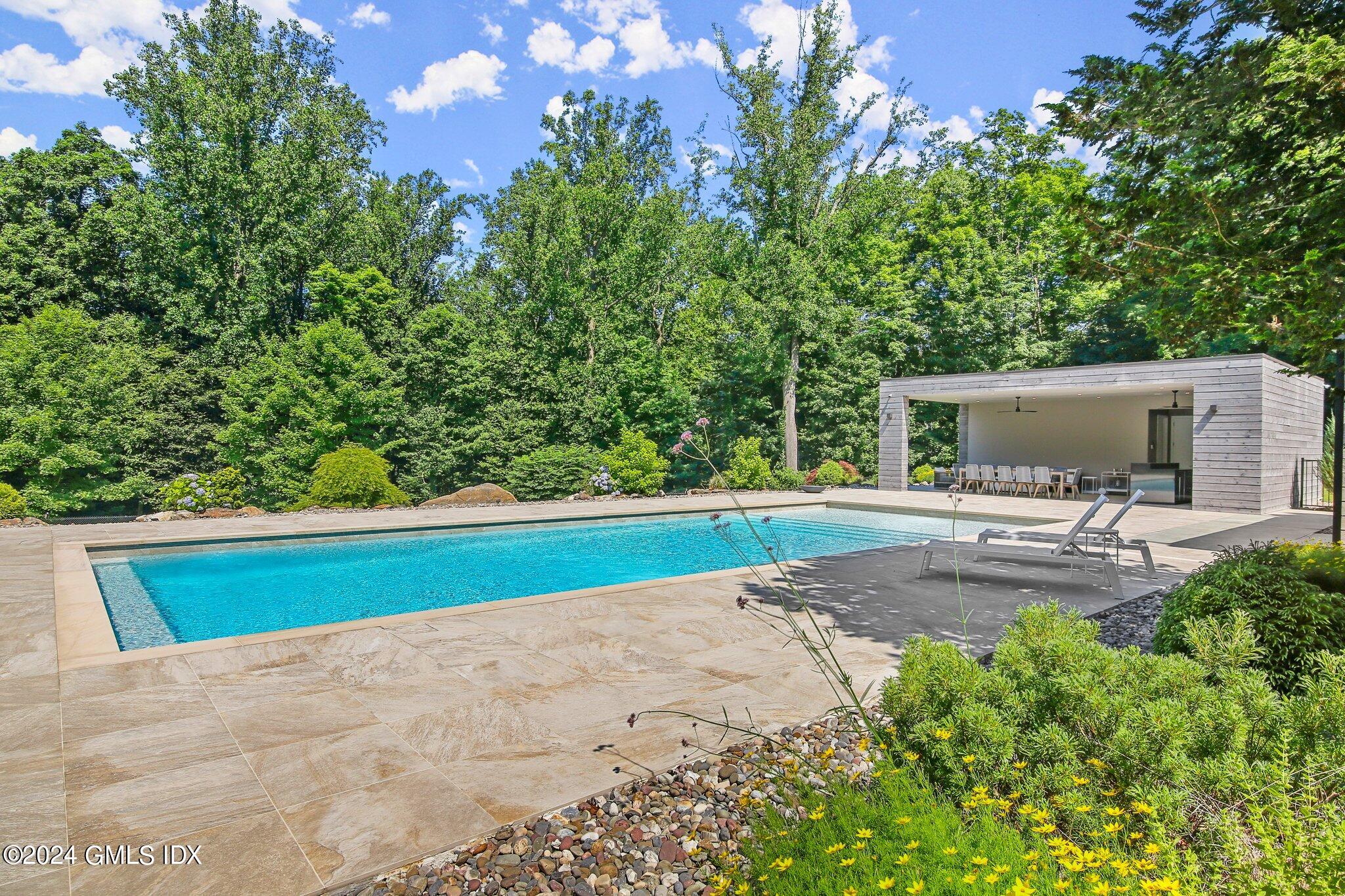 50 Sumner Road Greenwich, CT 06831 - Photo 50 of 69 a view of a backyard with swimming pool