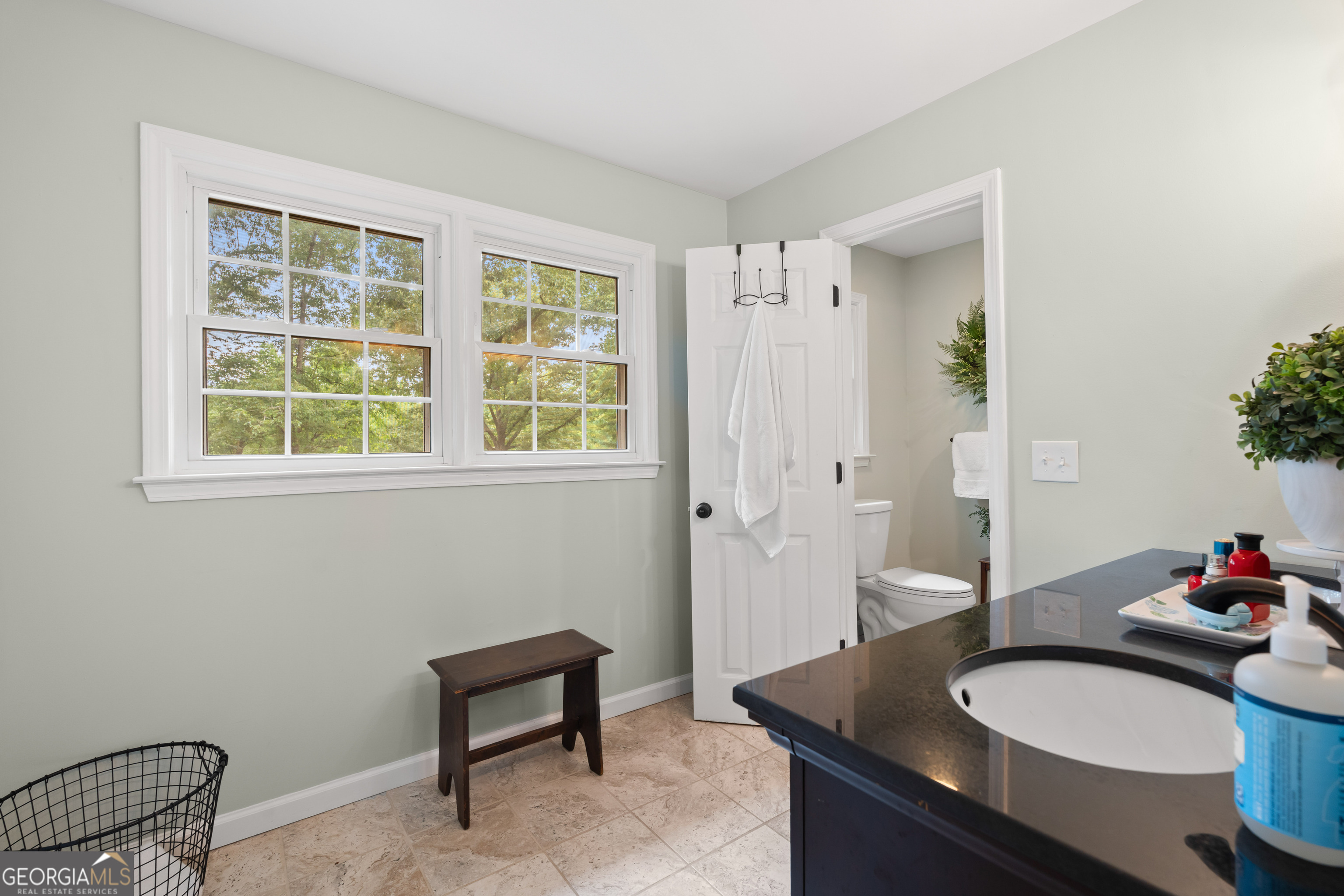 836 Oak Grove Road Carrollton, GA 30117 - Photo 36 of 50 a bathroom with a granite countertop sink and a mirror