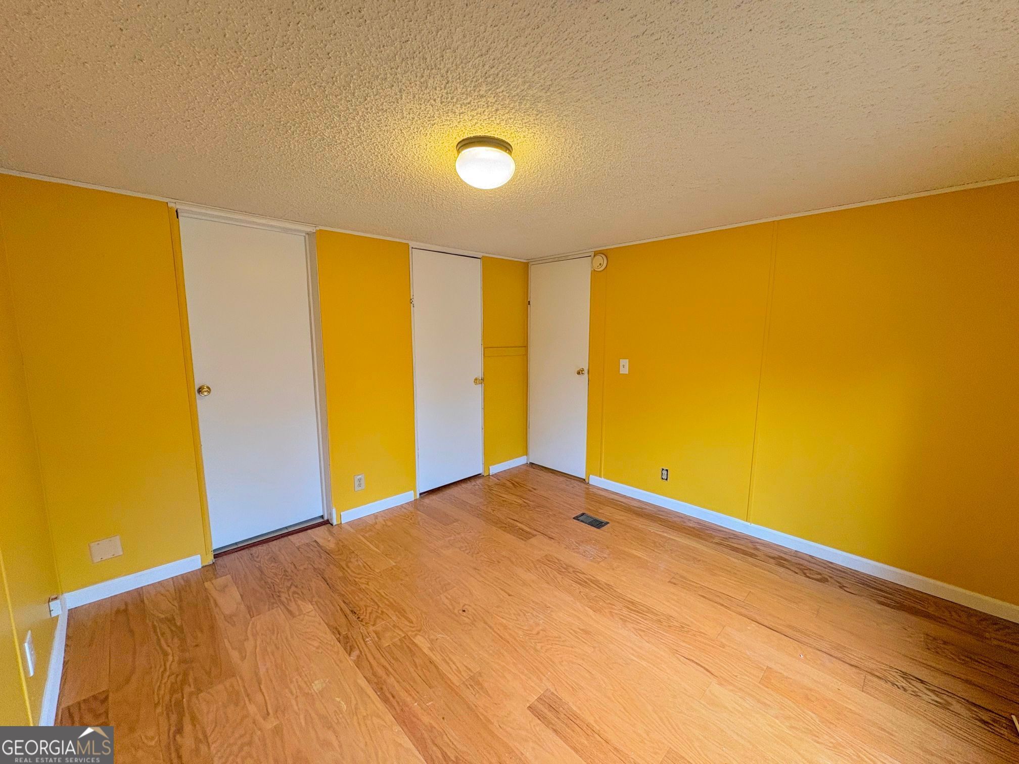 319 Wages Road Auburn, GA 30011 - Photo 15 of 26 a view of big room with wooden floor
