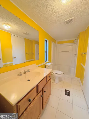 a bathroom with a sink a toilet and a tub