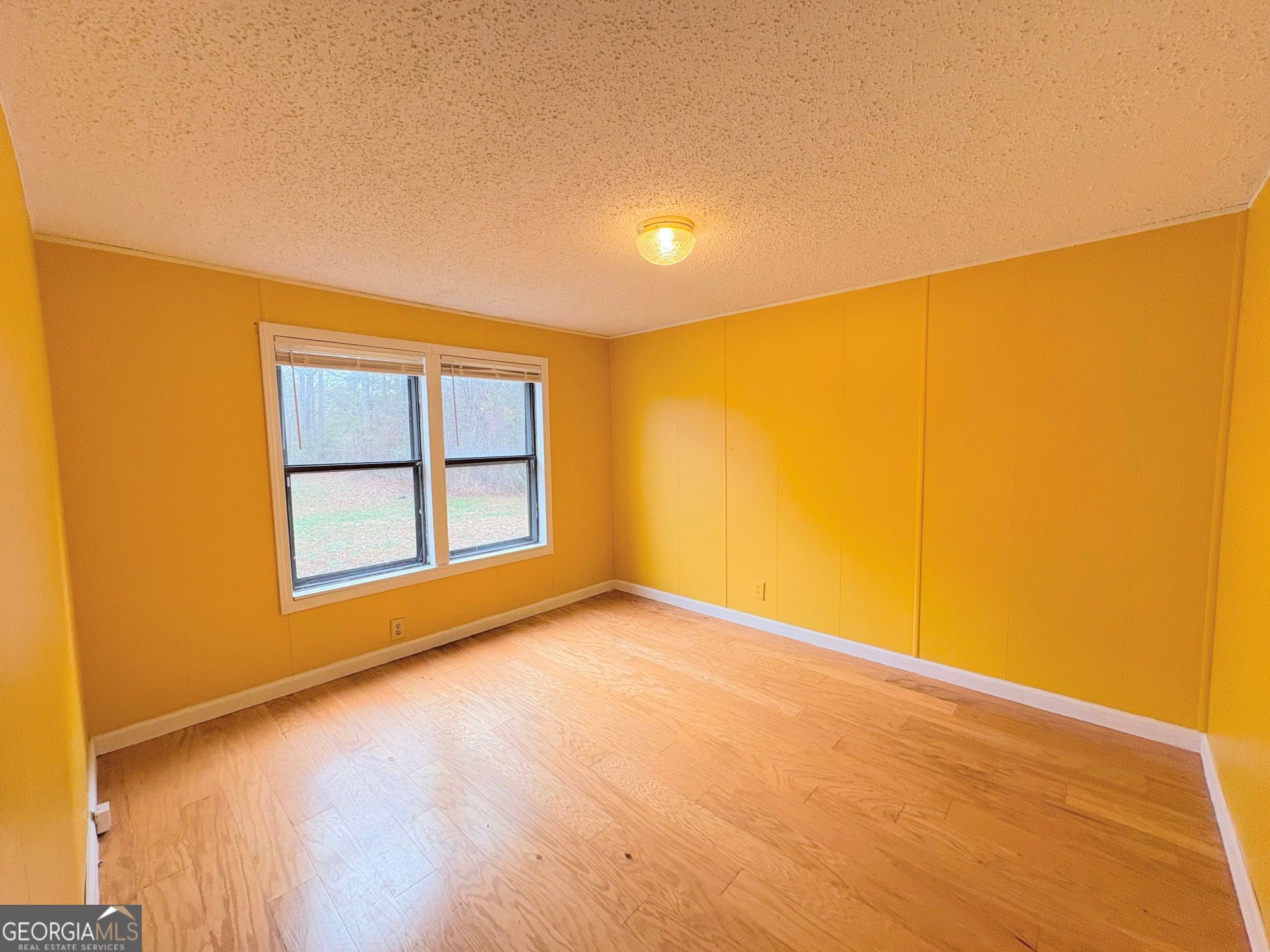 319 Wages Road Auburn, GA 30011 - Photo 18 of 26 a view of an empty room with a window