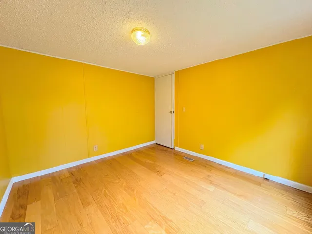 a view of big room with wooden floor