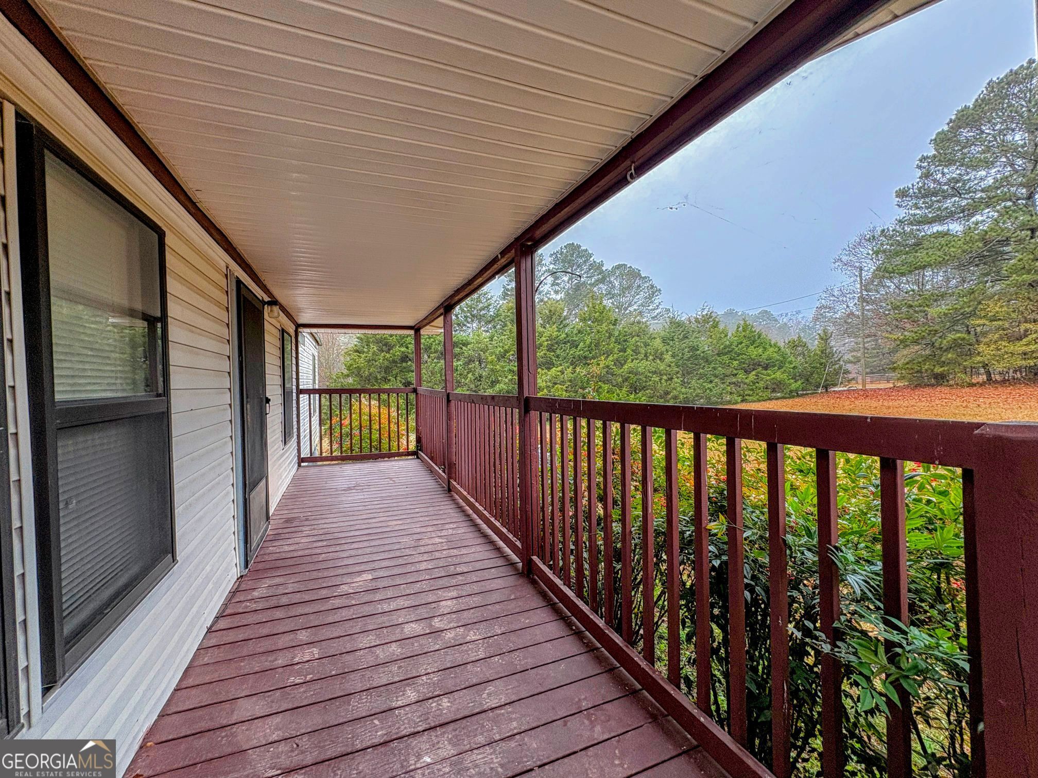319 Wages Road Auburn, GA 30011 - Photo 4 of 26 a view of balcony with wooden floor