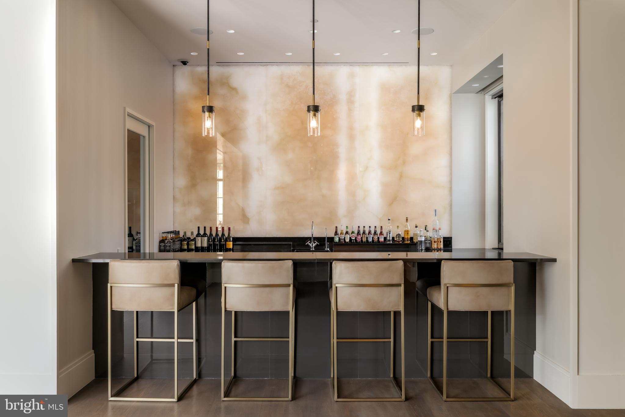 3240 Prospect Street Northwest Washington, DC 20007 - Photo 9 of 50 Bar with Onyx LED accent wall and pendant lights