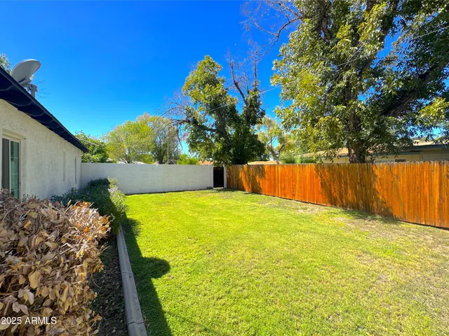 a view of swimming pool with a backyard