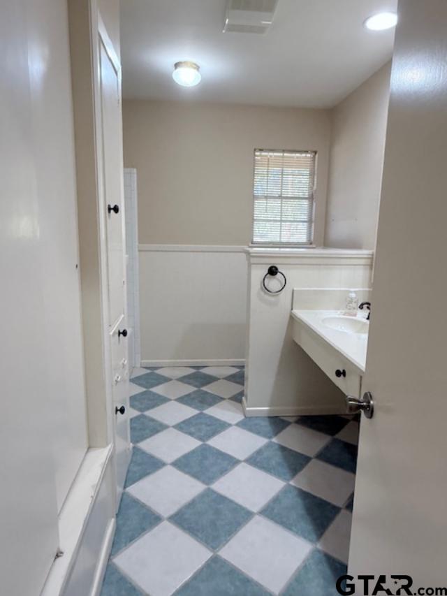 534 Fair Lane Tyler, TX 75701 - Photo 16 of 30 a view of a bathroom with a sink and a shower