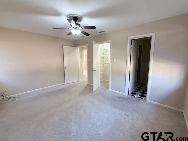 534 Fair Lane Tyler, TX 75701 - Photo 22 of 30 a view of an empty room with a ceiling fan