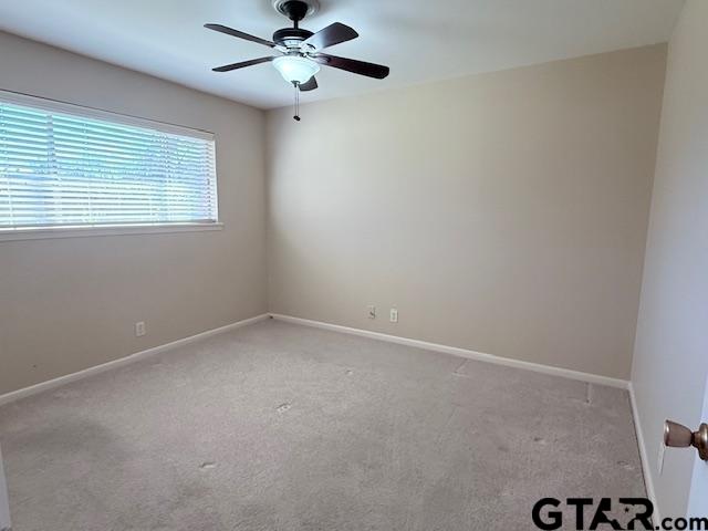 534 Fair Lane Tyler, TX 75701 - Photo 25 of 30 an empty room with a window and a fan