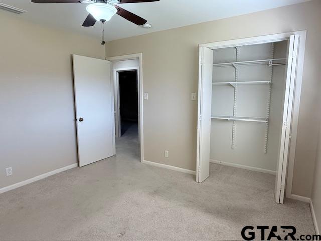 534 Fair Lane Tyler, TX 75701 - Photo 26 of 30 en empty room with closet and a ceiling fan