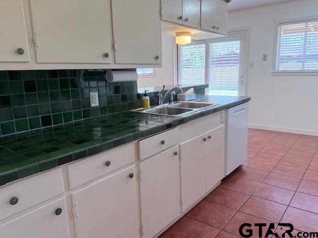 534 Fair Lane Tyler, TX 75701 - Photo 6 of 30 a kitchen with granite countertop white cabinets and a sink