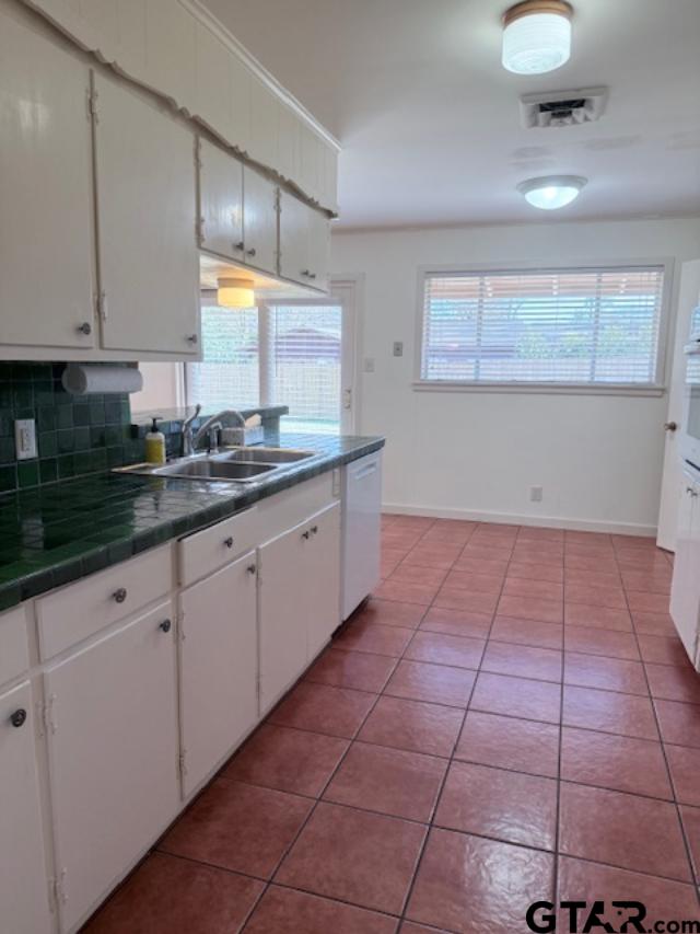 534 Fair Lane Tyler, TX 75701 - Photo 7 of 30 a kitchen with a sink and cabinets