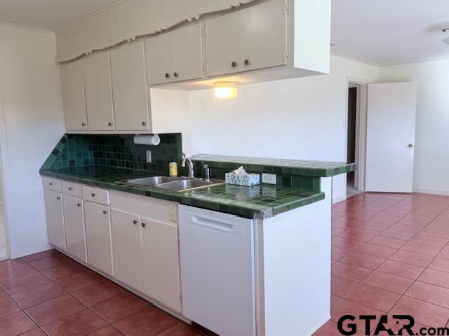 534 Fair Lane Tyler, TX 75701 - Photo 9 of 30 a kitchen with granite countertop white cabinets and a sink