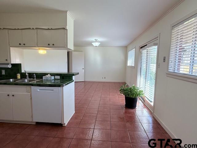 534 Fair Lane Tyler, TX 75701 - Photo 10 of 30 a kitchen with a white cabinets and potted plant