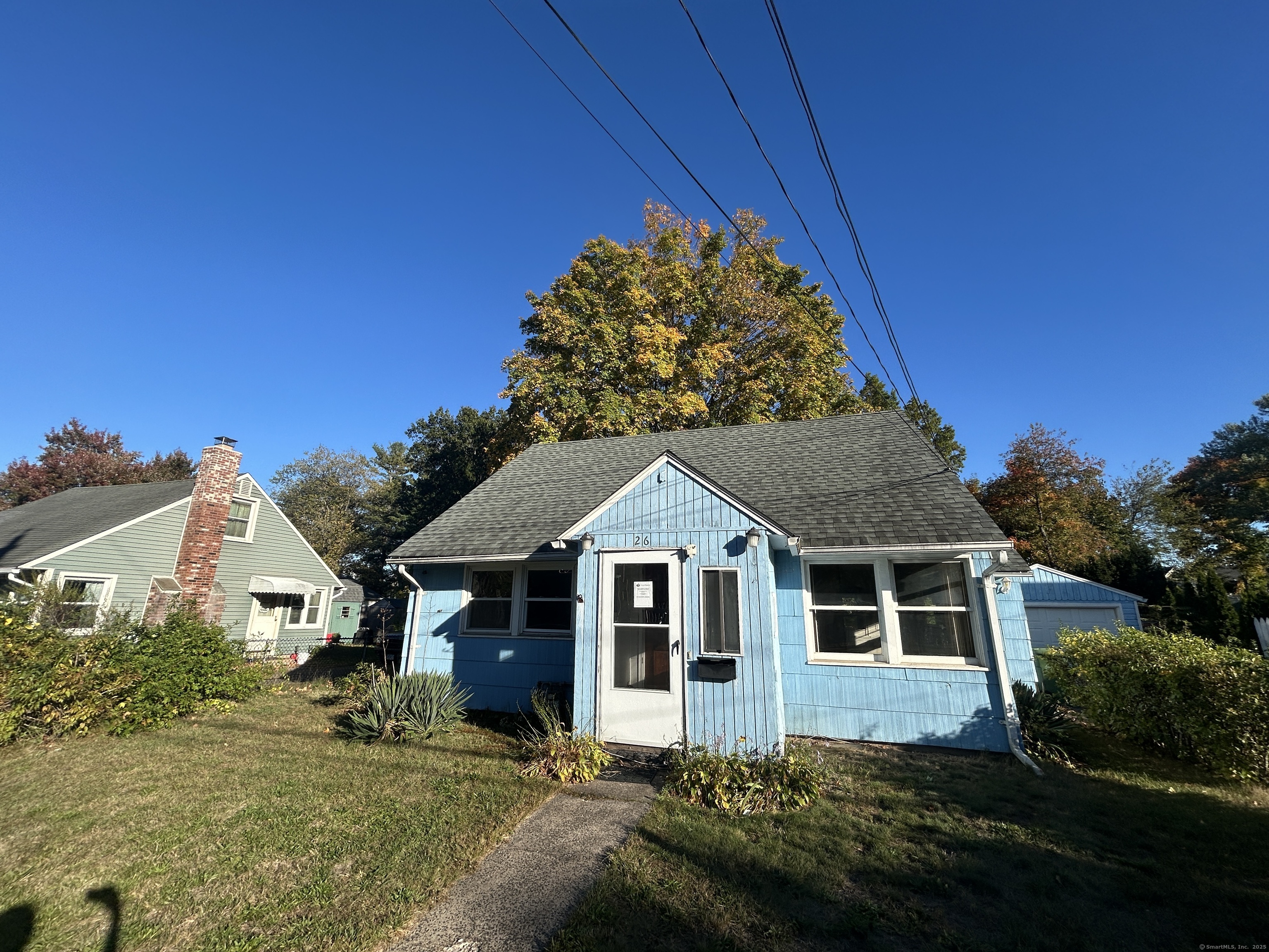 26 West Street Wallingford, CT 06492 - Photo 1 of 1 a front view of a house with a yard