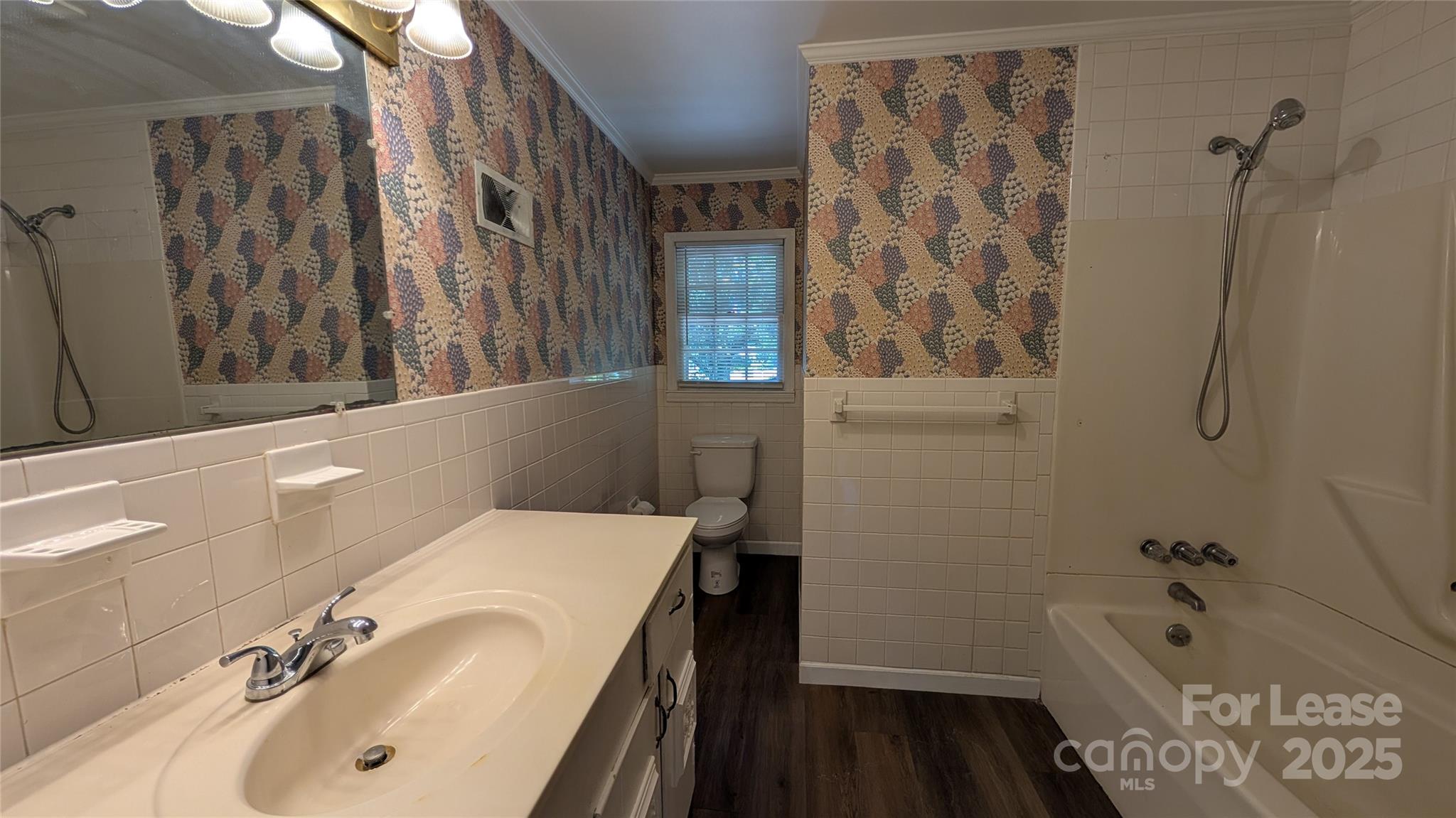 3889 Poplar Tent Road Concord, NC 28027 - Photo 15 of 33 a bathroom with a tub sink and mirror