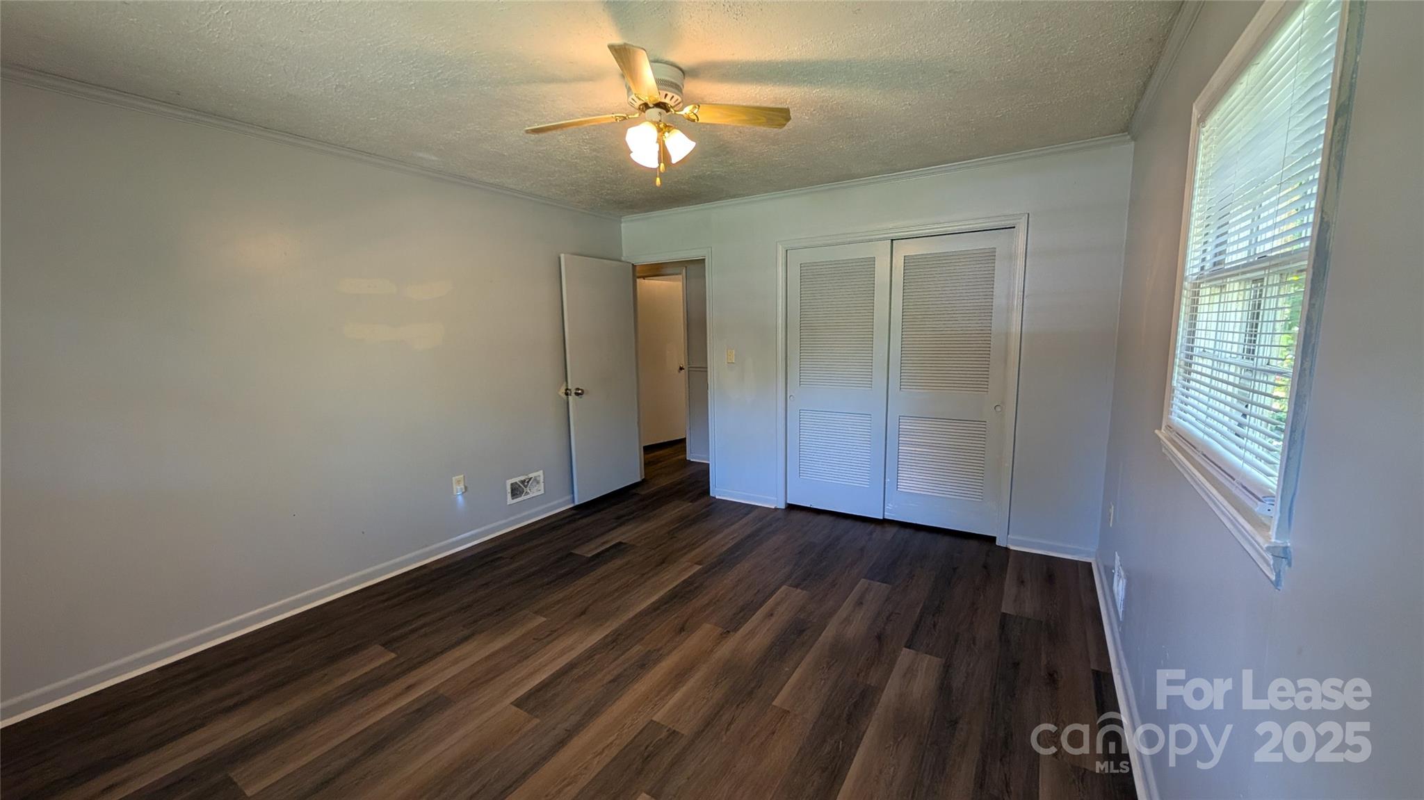 3889 Poplar Tent Road Concord, NC 28027 - Photo 20 of 33 wooden floor in an empty room with a window