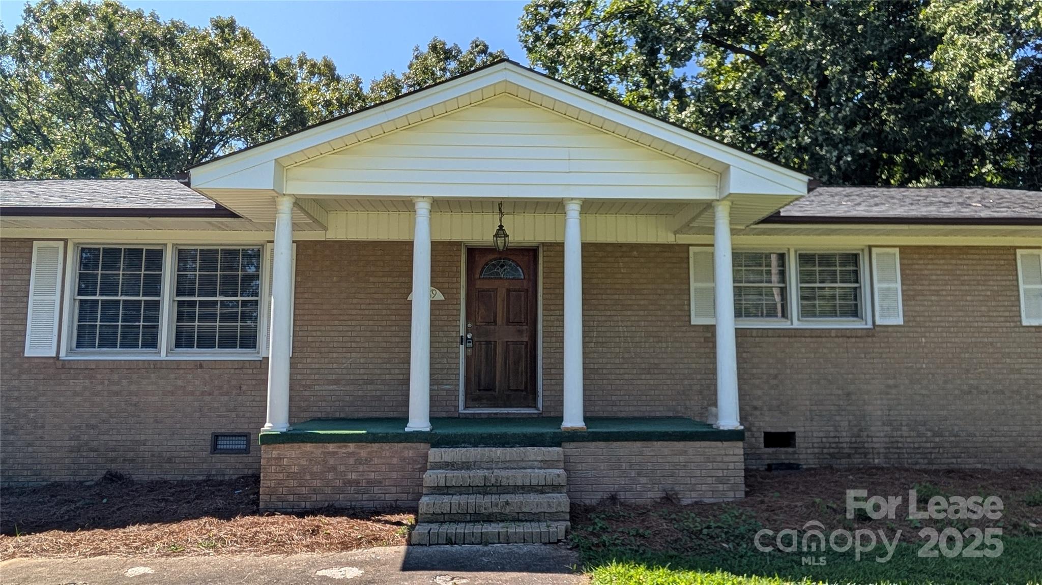 3889 Poplar Tent Road Concord, NC 28027 - Photo 2 of 33 a front view of a house with garden