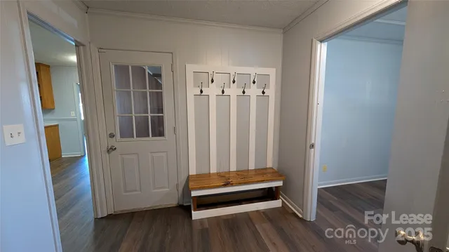 a view of a room with wooden floor and stairs
