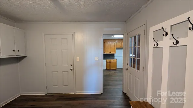 a view of entryway with wooden floor