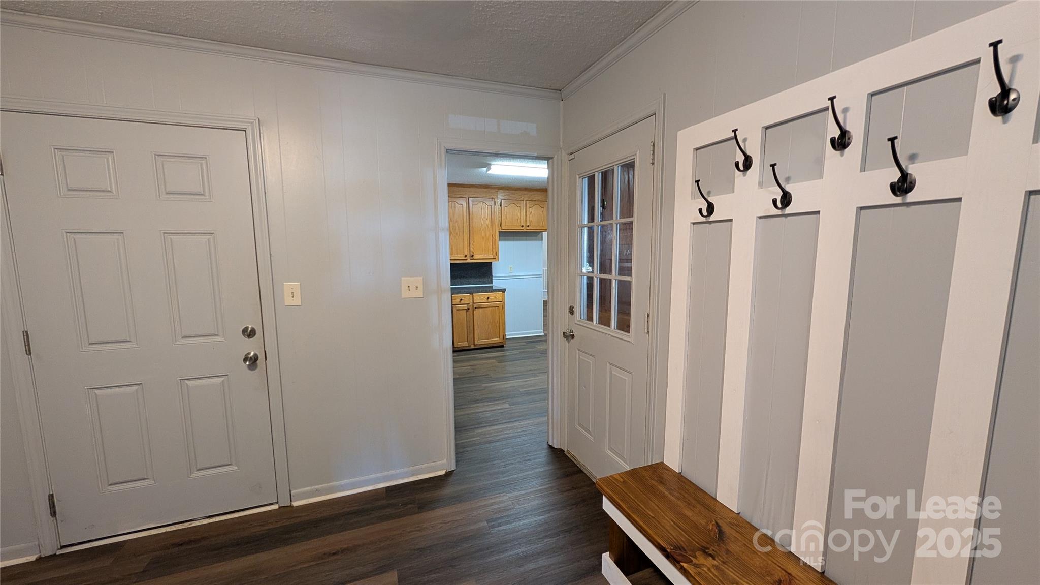 3889 Poplar Tent Road Concord, NC 28027 - Photo 29 of 33 a view of a hallway with wooden floor and entryway