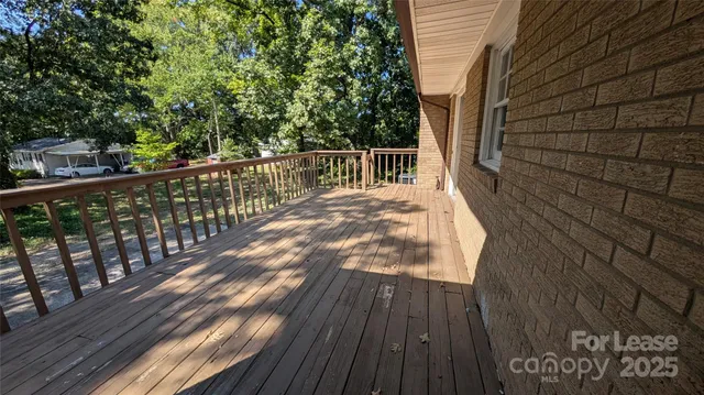 a view of deck with wooden floor and outdoor seating