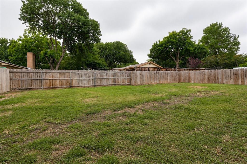 2908 Legend Road Arlington, TX 76014 - Photo 28 of 29 Expansive lawn area featuring a full privacy fence
