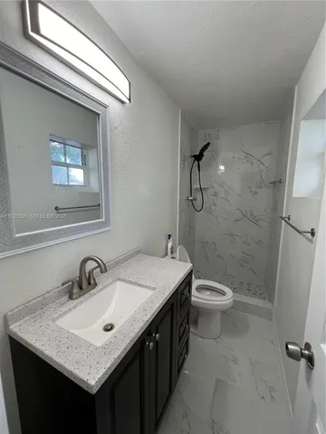 a bathroom with a sink and a toilet