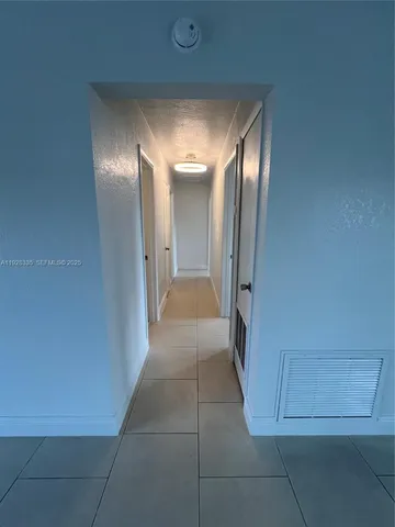 a view of a hallway with entryway