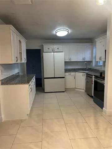 a kitchen with a cabinets and counter space