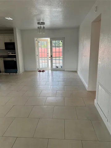 a view of an empty room with a window