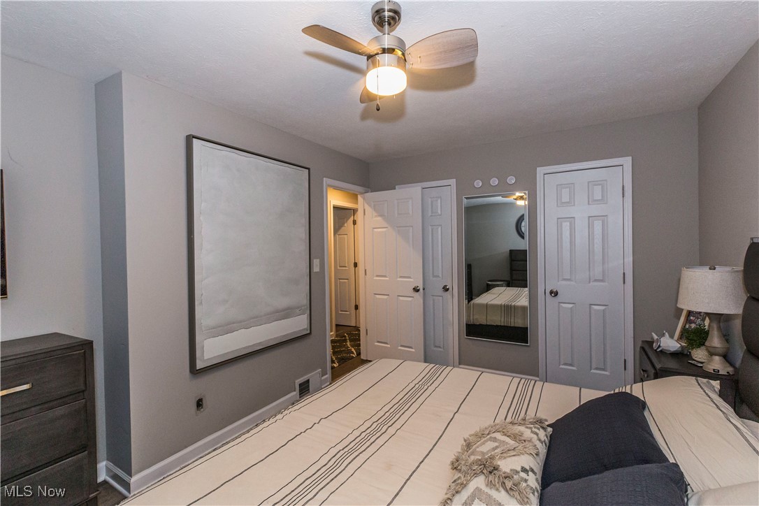 2430 Rockside Road Independence, OH 44131 - Photo 24 of 46 Bedroom with ceiling fan and multiple closets