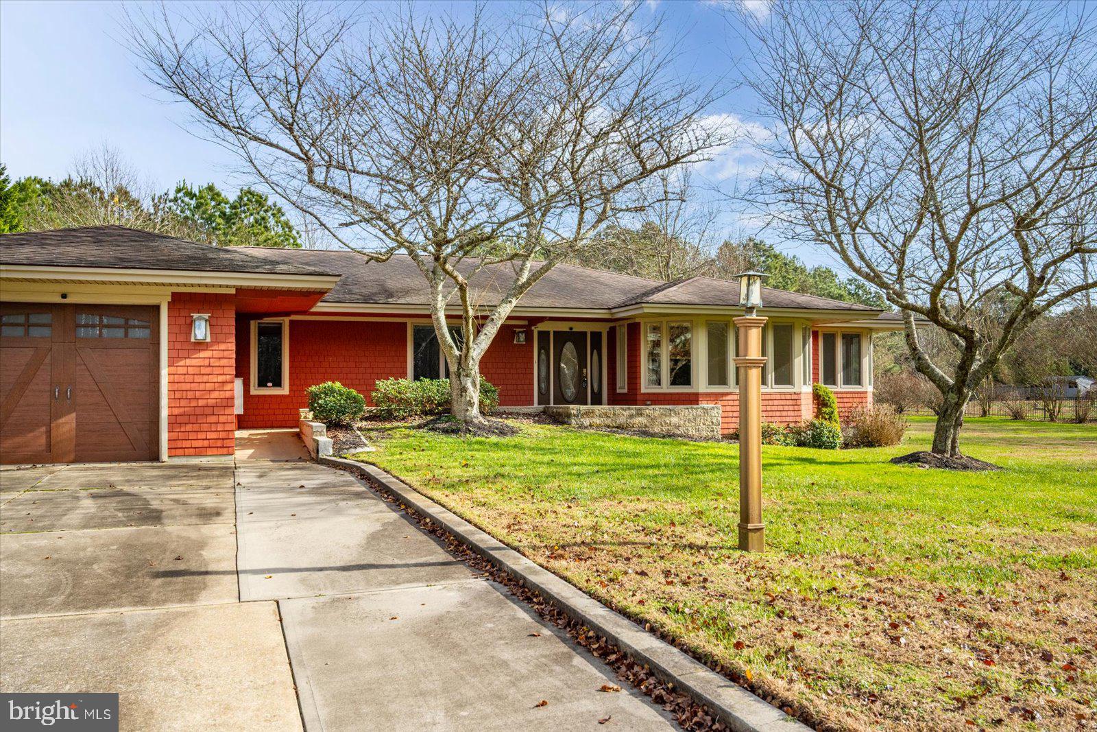 8814 Hunting Hound Road Berlin, MD 21811 - Photo 48 of 65 a front view of a house with a yard