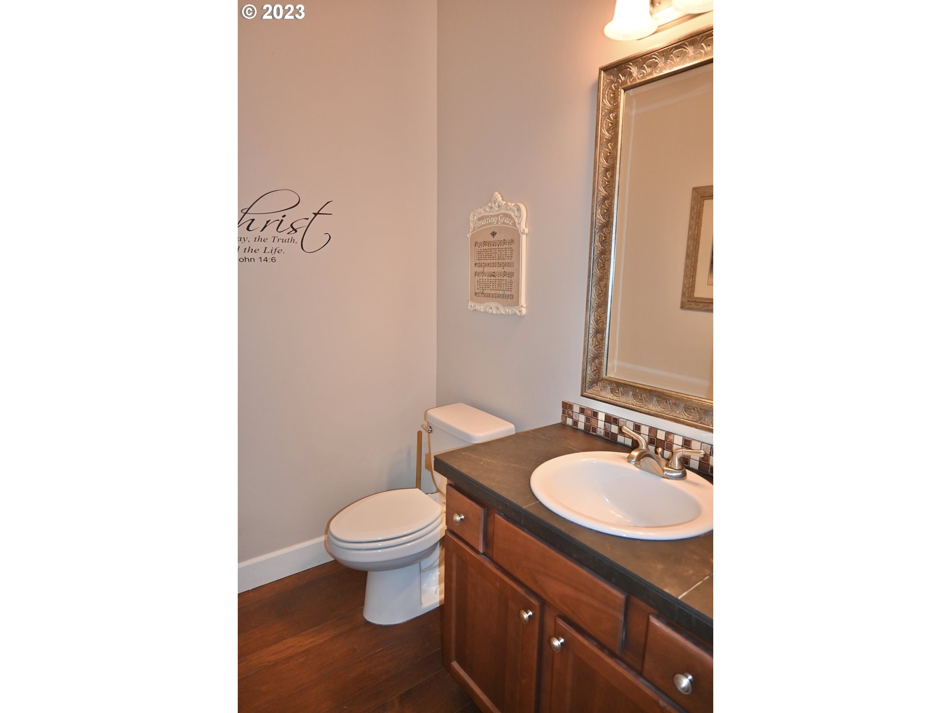 3623 Comiskey Street Forest Grove, OR 97116 - Photo 13 of 43 a bathroom with a granite countertop sink toilet and mirror