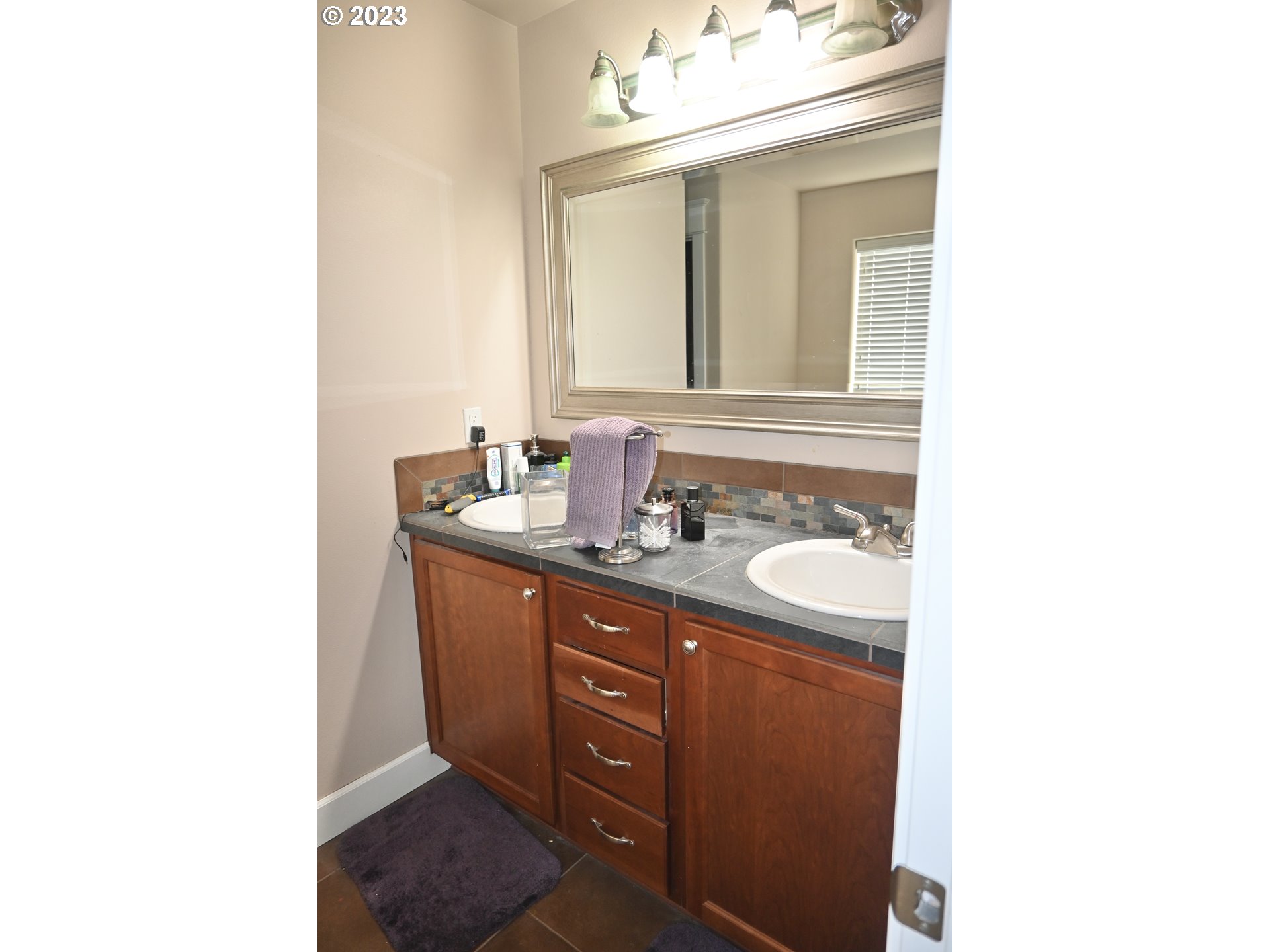 3623 Comiskey Street Forest Grove, OR 97116 - Photo 23 of 43 a bathroom with a sink and a mirror