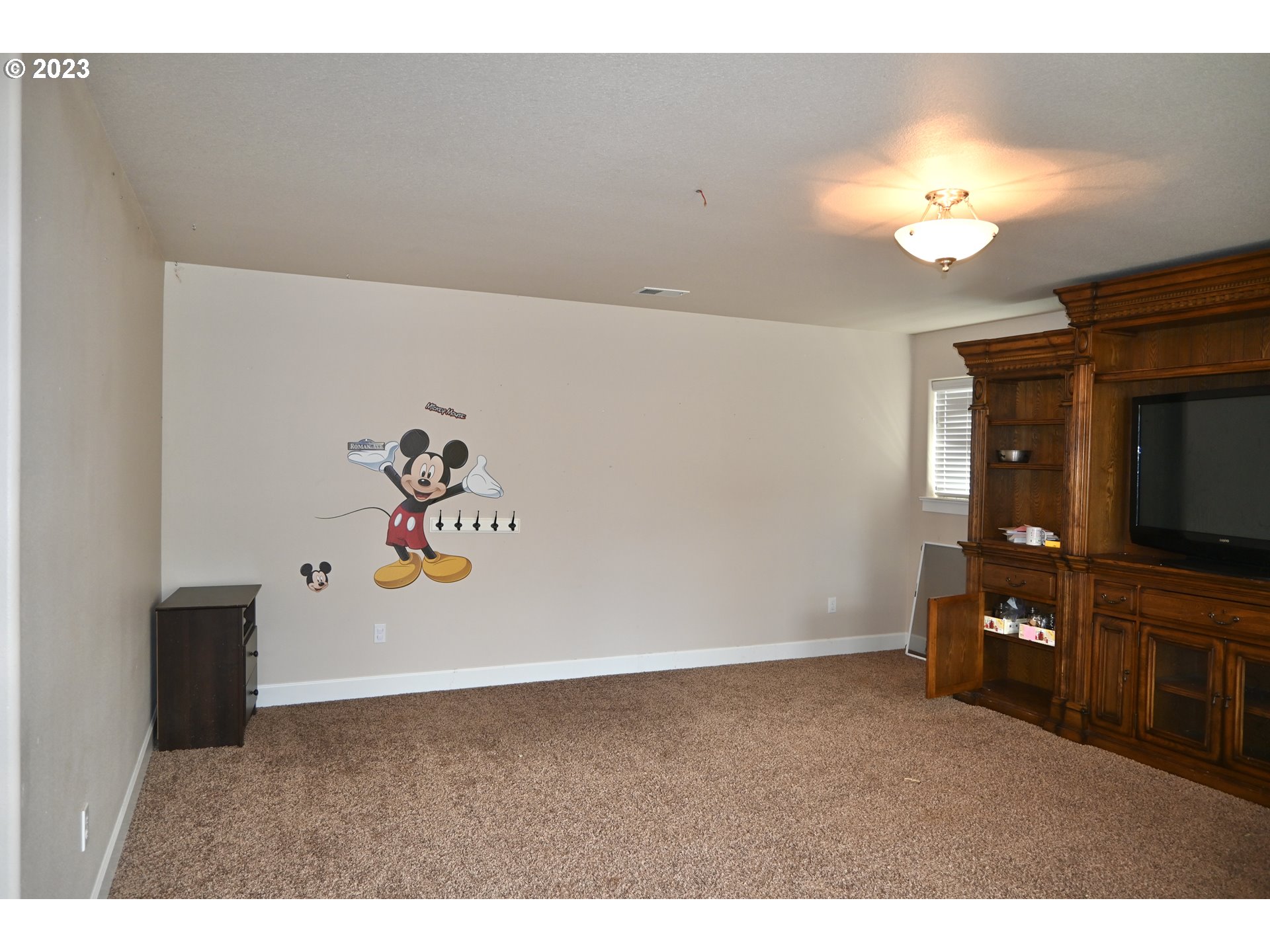 3623 Comiskey Street Forest Grove, OR 97116 - Photo 26 of 43 a view of a livingroom with a flat screen tv