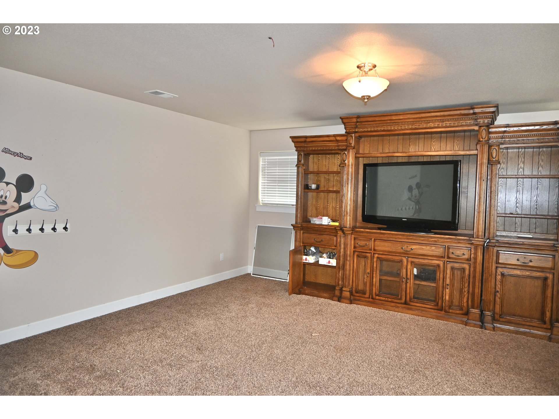 3623 Comiskey Street Forest Grove, OR 97116 - Photo 27 of 43 a living room with furniture and a flat screen tv