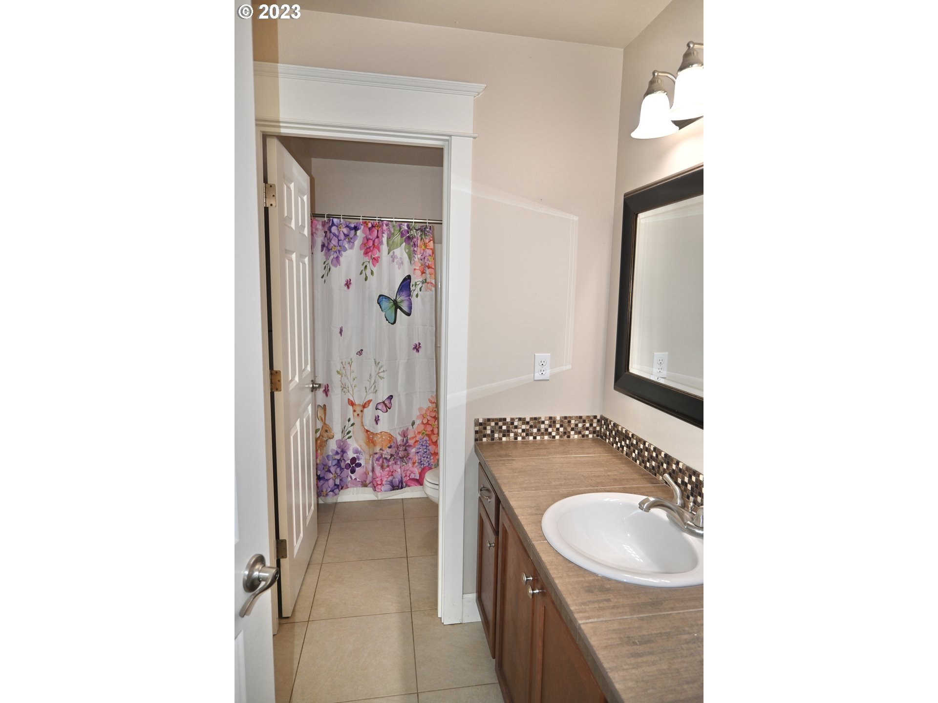 3623 Comiskey Street Forest Grove, OR 97116 - Photo 35 of 43 a bathroom with a sink and mirror with toilet