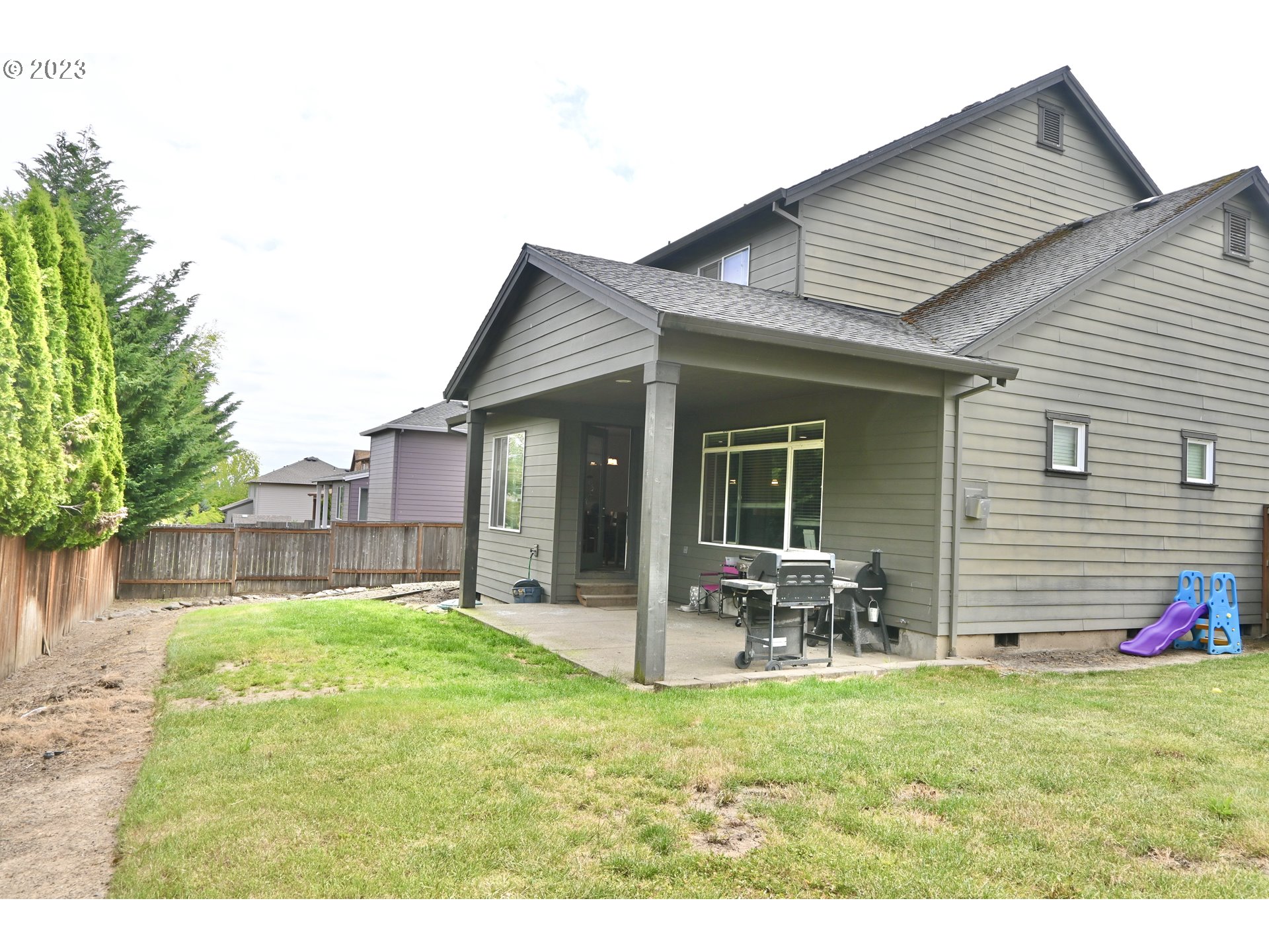 3623 Comiskey Street Forest Grove, OR 97116 - Photo 39 of 43 a backyard of a house with table and chairs
