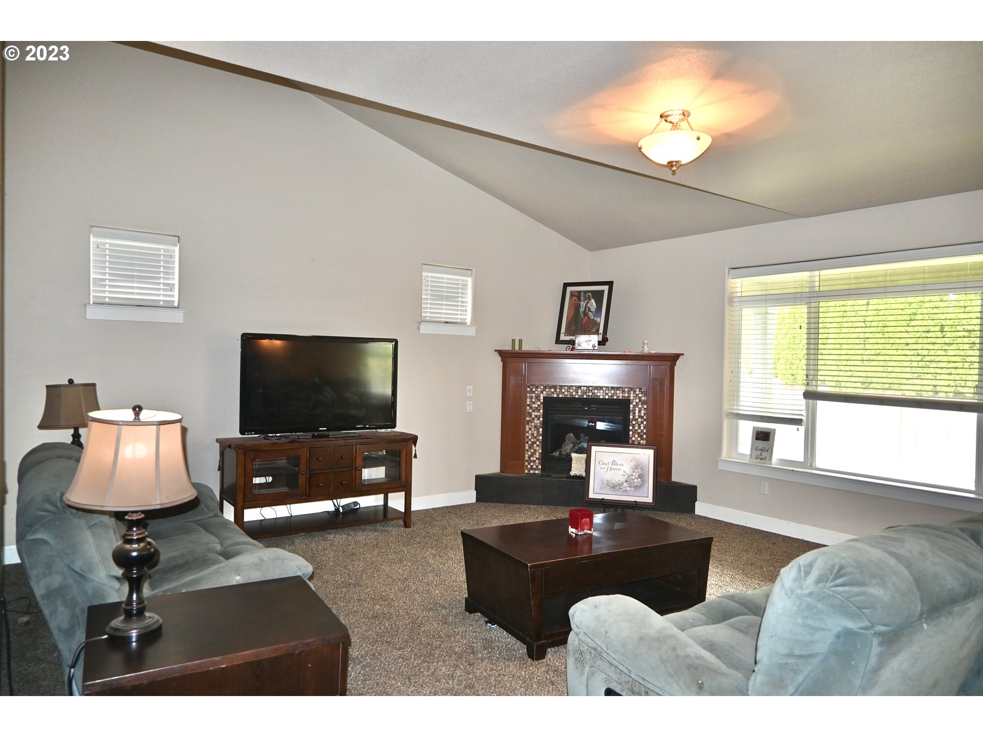 3623 Comiskey Street Forest Grove, OR 97116 - Photo 5 of 43 a living room with furniture and a flat screen tv