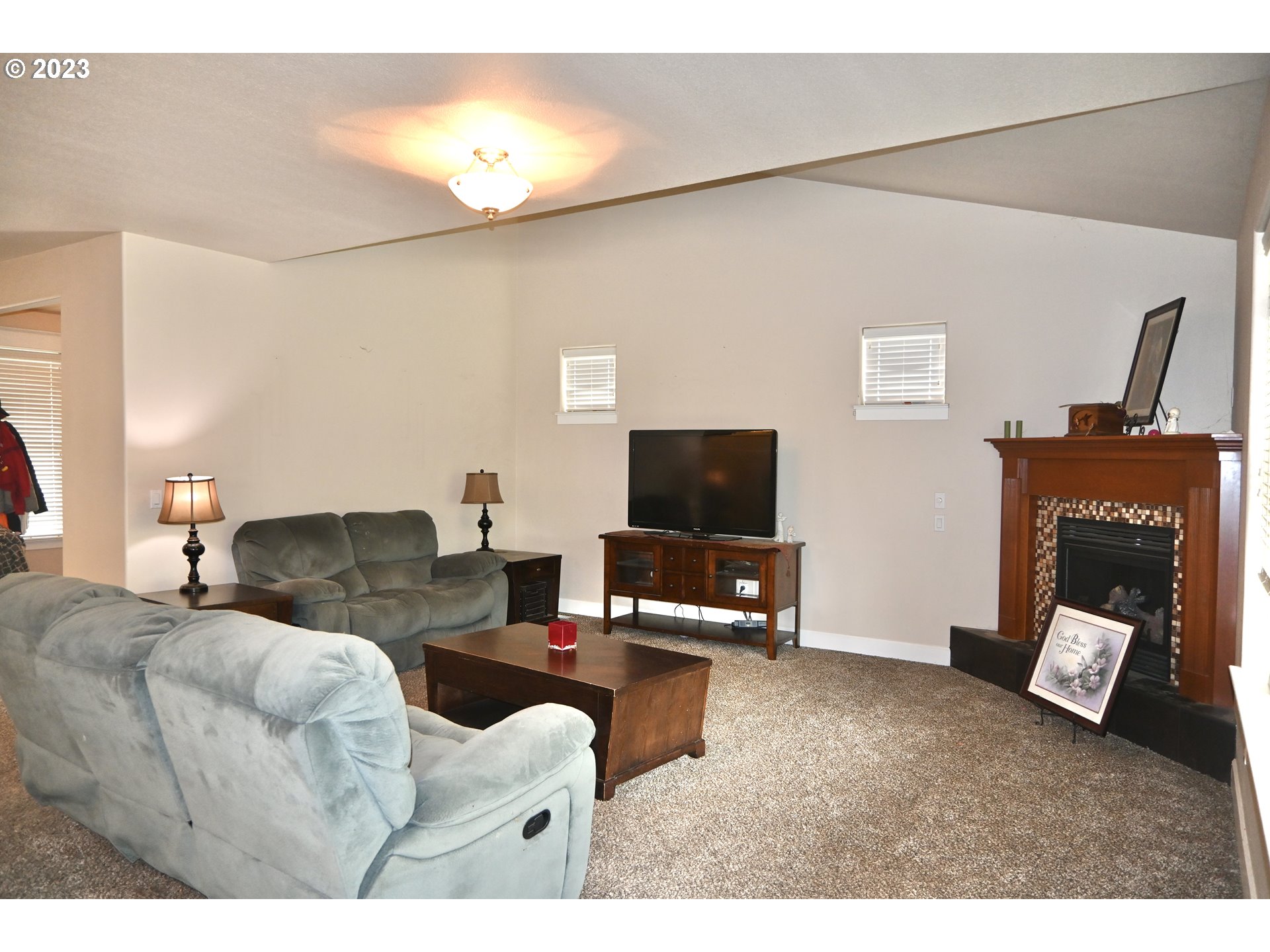 3623 Comiskey Street Forest Grove, OR 97116 - Photo 6 of 43 a living room with furniture and a flat screen tv