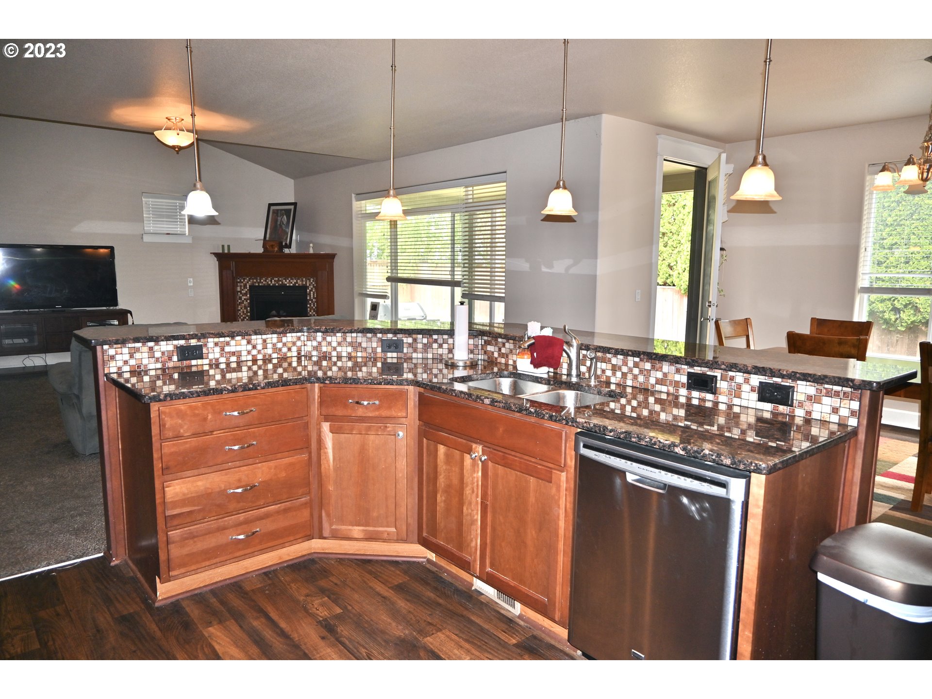 3623 Comiskey Street Forest Grove, OR 97116 - Photo 8 of 43 a kitchen with granite countertop a sink and cabinets