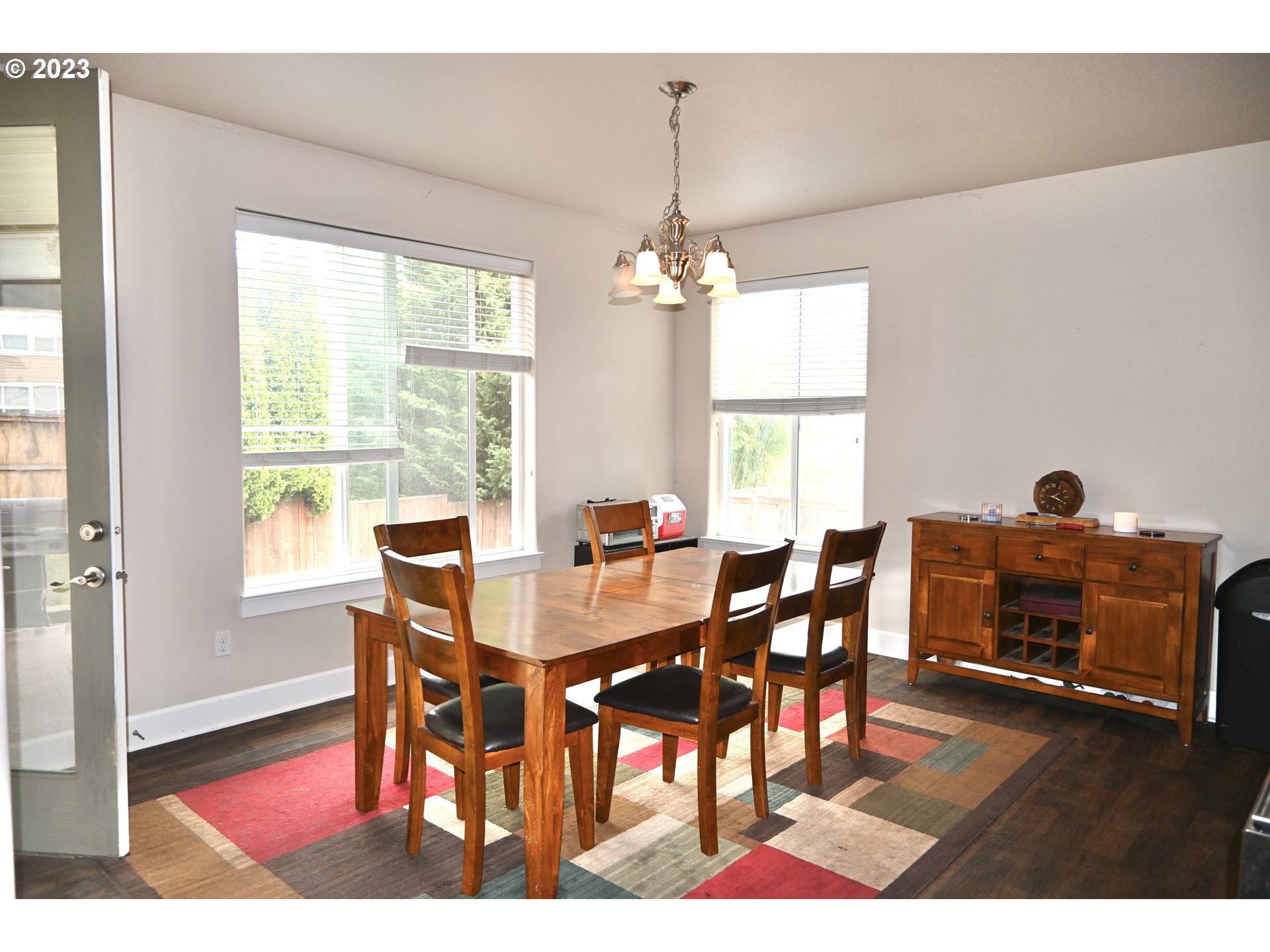 3623 Comiskey Street Forest Grove, OR 97116 - Photo 10 of 43 a view of a dining room with furniture window and wooden floor