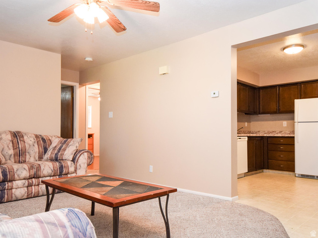 240 East 400 North, Unit 26 Logan, UT 84321 - Photo 4 of 10 Living room with a ceiling fan and baseboards