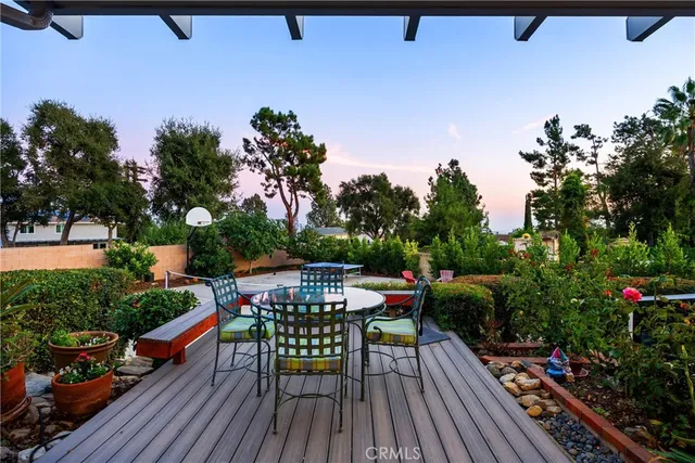 an aerial view of a house with a yard and parking
