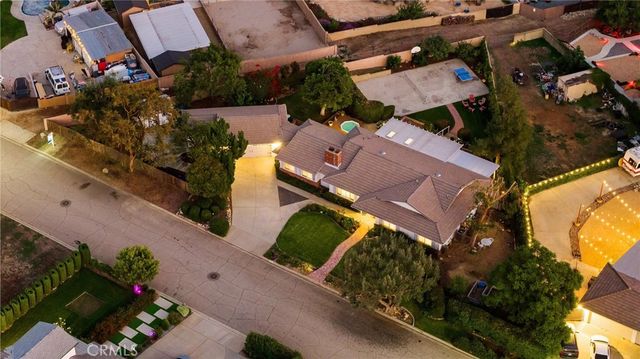 a view of a chair and table in the garden