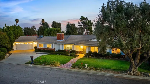 a view of a chairs and table in backyard