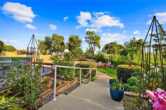 a large bathroom with a granite countertop double vanity sink a mirror and a shower